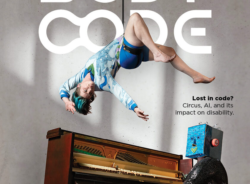 A poster for Vulcana's upcoming show Body Code at Kingston Butter Factory November 21-22. It shows an acrobat suspended above a piano being played by a person with a box on their head.