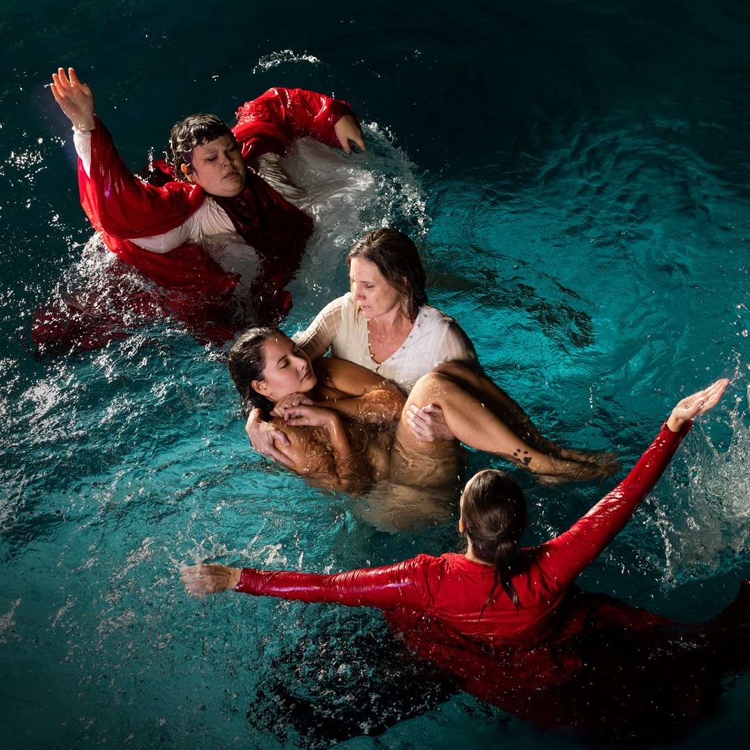Four people in a pool advertising a show called Cashless and Carefree